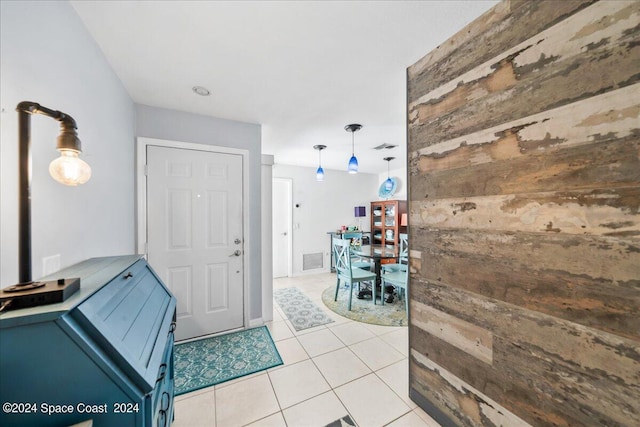 190 Shell Pl Unit 84, Rockledge, FL 32955 - foyer with wood walls and light tile patterned flooring