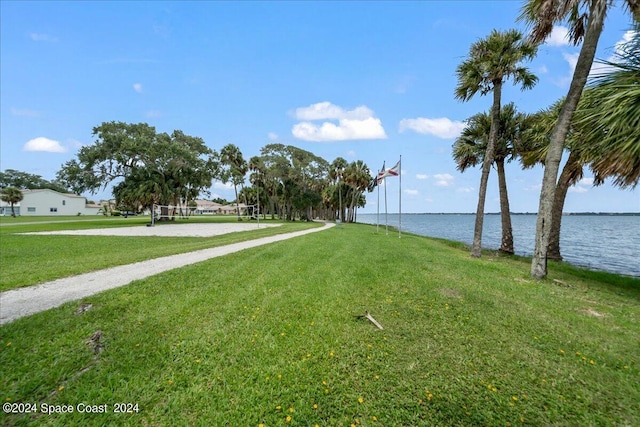 190 Shell Pl Unit 84, Rockledge, FL 32955 - view of home's community with volleyball court, a water view, and a lawn