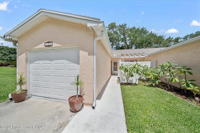 190 Shell Pl Unit 84, Rockledge, FL 32955 - view of property exterior featuring stucco siding and a yard