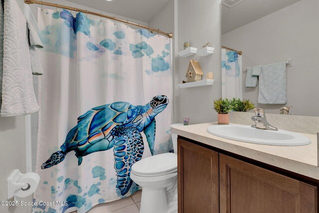 4070 Sage Brush Cir, Melbourne, FL 32901 - bathroom with vanity, tile patterned flooring, and a shower with shower curtain