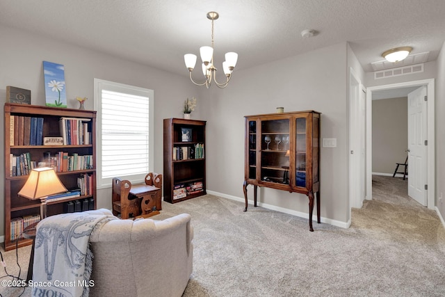 4070 Sage Brush Cir, Melbourne, FL 32901 - living area featuring a chandelier, carpet flooring, and a textured ceiling