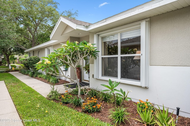3469 Horse Creek Cir, Melbourne, FL 32935 - view of side of home featuring stucco siding