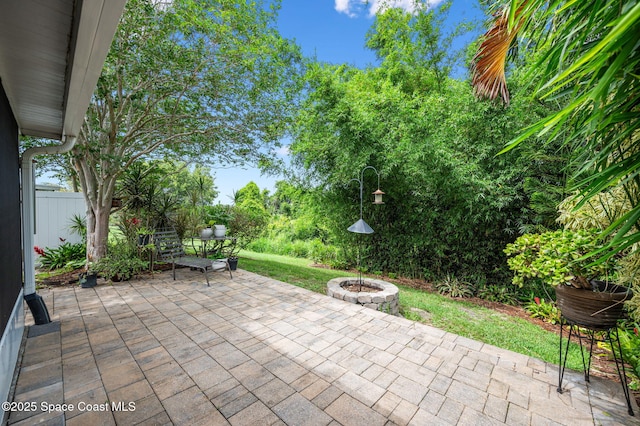 3469 Horse Creek Cir, Melbourne, FL 32935 - view of patio / terrace with a fire pit