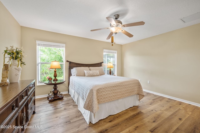 3469 Horse Creek Cir, Melbourne, FL 32935 - bedroom featuring light wood-type flooring, baseboards, and ceiling fan