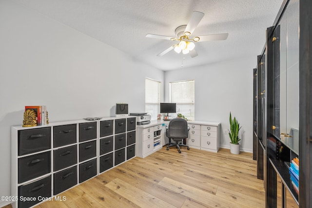 3469 Horse Creek Cir, Melbourne, FL 32935 - office space featuring light wood finished floors, ceiling fan, and a textured ceiling