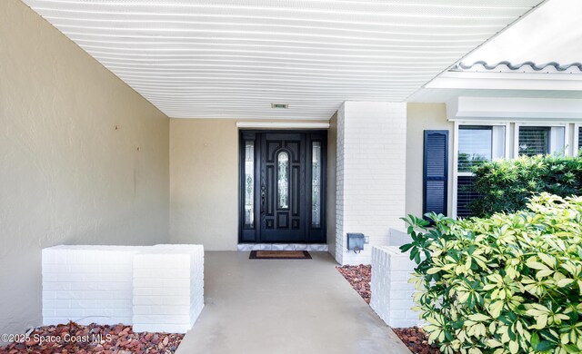 630 Seville Ct, Satellite Beach, FL 32937 - entrance to property with stucco siding and brick siding