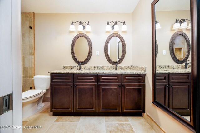 630 Seville Ct, Satellite Beach, FL 32937 - full bath with double vanity and toilet