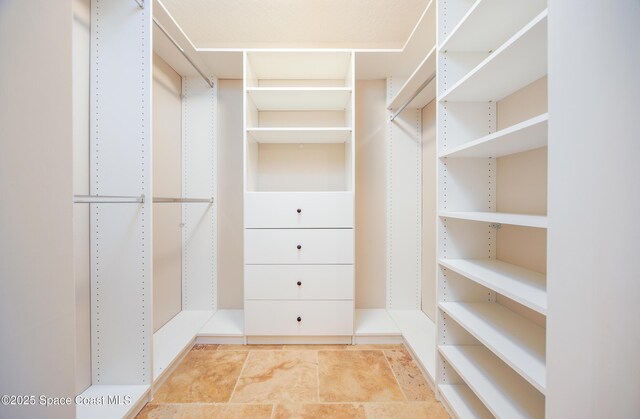 630 Seville Ct, Satellite Beach, FL 32937 - spacious closet featuring stone finish flooring
