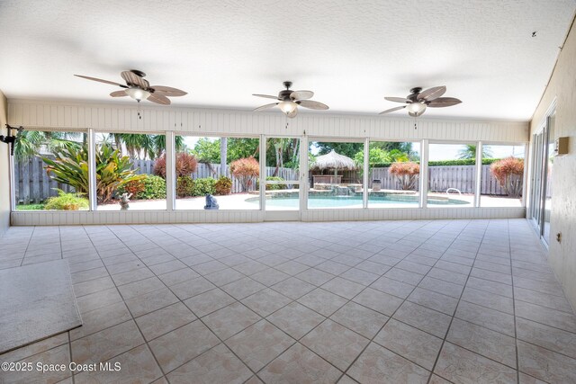630 Seville Ct, Satellite Beach, FL 32937 - unfurnished sunroom featuring tile patterned flooring and plenty of natural light