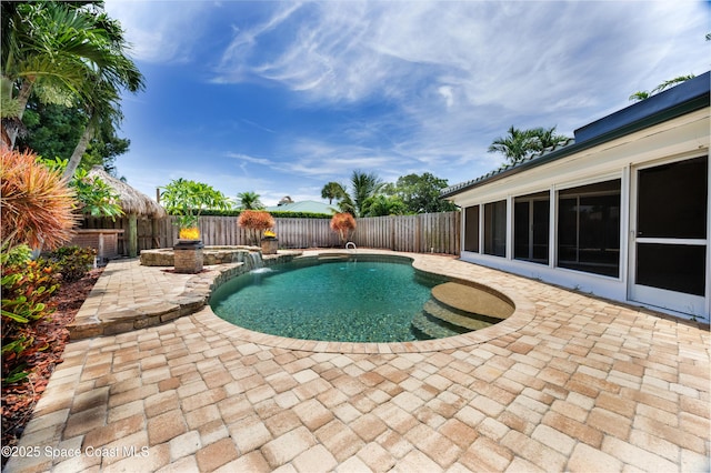 630 Seville Ct, Satellite Beach, FL 32937 - view of swimming pool with a patio area, a fenced backyard, and a pool with connected hot tub