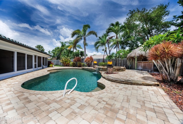 630 Seville Ct, Satellite Beach, FL 32937 - view of swimming pool with a patio, a fenced backyard, and a sunroom