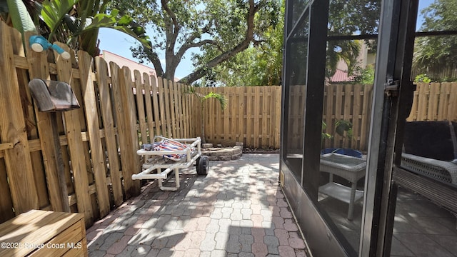 8714 Jasmine Ct, Cape Canaveral, FL 32920 - fenced backyard with a patio area