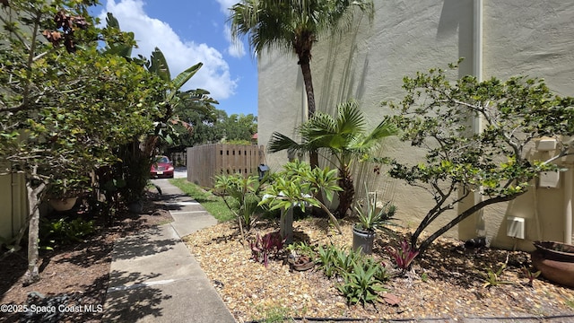 8714 Jasmine Ct, Cape Canaveral, FL 32920 - view of side of home with stucco siding