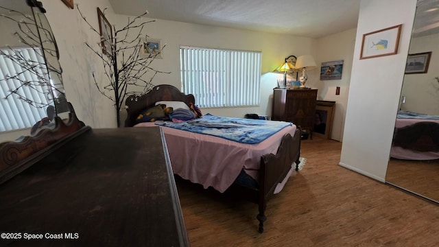 8714 Jasmine Ct, Cape Canaveral, FL 32920 - bedroom featuring wood finished floors