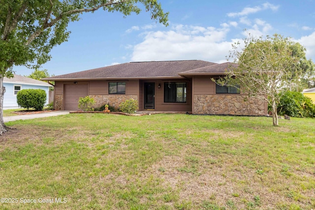 662 Estaugh St NW, Palm Bay, FL 32907 - single story home featuring stone siding, an attached garage, concrete driveway, and a front lawn