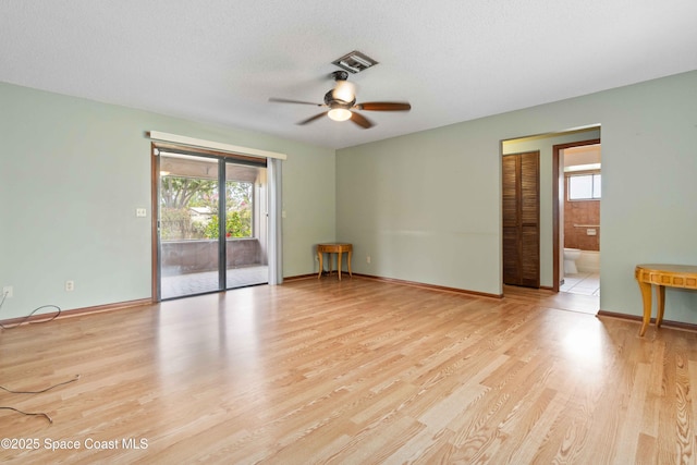 662 Estaugh St NW, Palm Bay, FL 32907 - empty room with a ceiling fan, light wood finished floors, and baseboards