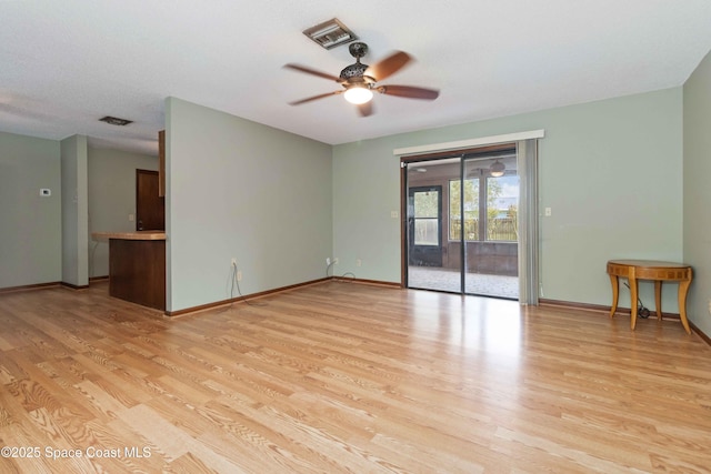 662 Estaugh St NW, Palm Bay, FL 32907 - unfurnished room featuring light wood finished floors, a ceiling fan, and baseboards