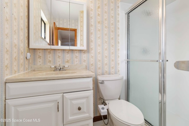 662 Estaugh St NW, Palm Bay, FL 32907 - full bath featuring wallpapered walls, vanity, a stall shower, and toilet