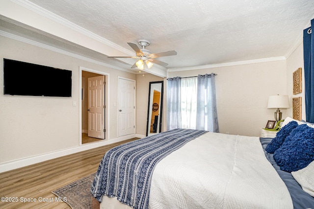 670 S Oak Park Cir E, Merritt Island, FL 32953 - bedroom featuring wood finished floors, crown molding, and ceiling fan