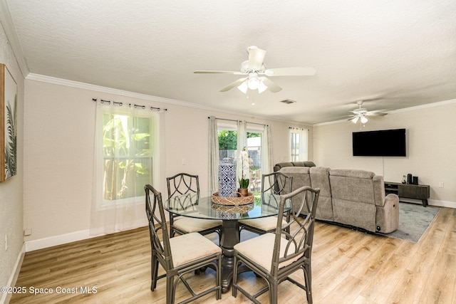 670 S Oak Park Cir E, Merritt Island, FL 32953 - dining area with a ceiling fan, light wood-style floors, and crown molding