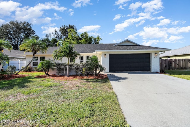 670 S Oak Park Cir E, Merritt Island, FL 32953 - single story home featuring stucco siding, a garage, and driveway