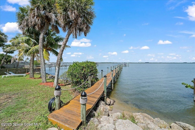 1999 S Misty Harbor Pl, Merritt Island, FL 32952 - dock featuring a water view and a yard