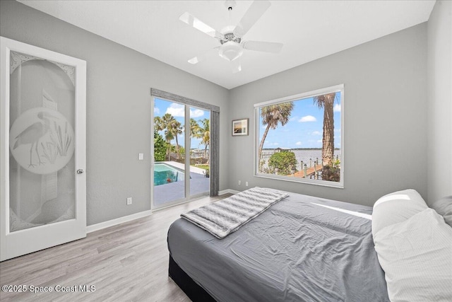 1999 S Misty Harbor Pl, Merritt Island, FL 32952 - bedroom with access to outside, light wood-style floors, and a ceiling fan