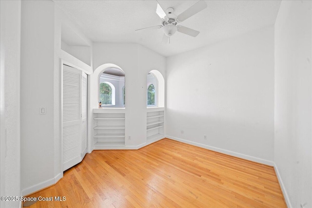 1999 S Misty Harbor Pl, Merritt Island, FL 32952 - unfurnished bedroom with wood finished floors, a closet, and a ceiling fan