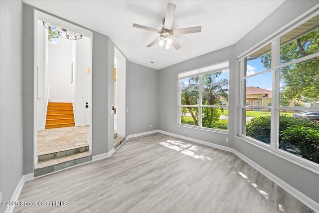 1999 S Misty Harbor Pl, Merritt Island, FL 32952 - unfurnished bedroom with wood finished floors and ceiling fan