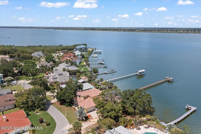 1999 S Misty Harbor Pl, Merritt Island, FL 32952 - aerial overview of property's location featuring a large body of water and nearby suburban area