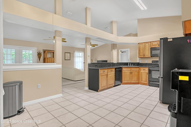 1486 Beche St SE, Palm Bay, FL 32909 - kitchen with black appliances, dark countertops, ceiling fan, high vaulted ceiling, and open floor plan