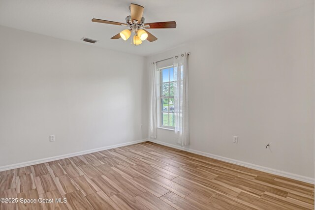 1486 Beche St SE, Palm Bay, FL 32909 - spare room with light wood-style flooring and ceiling fan