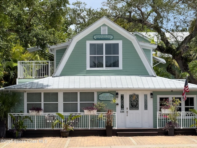 1700 Atlantic St Unit 1, Melbourne Beach, FL 32951 - view of front of property with a standing seam roof, a gambrel roof, and metal roof