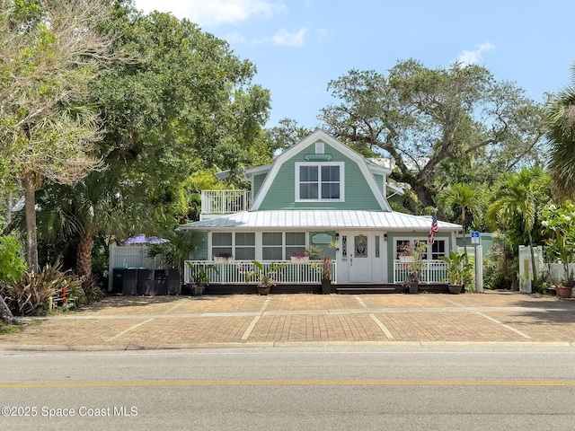 1700 Atlantic St Unit 1, Melbourne Beach, FL 32951 - view of front of property with a gambrel roof and a porch