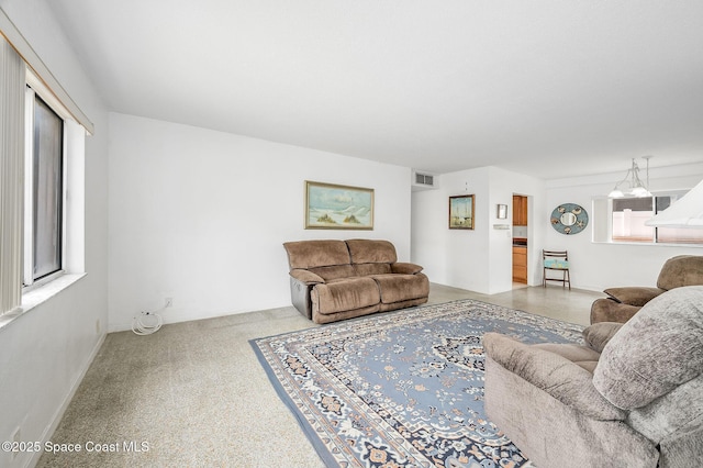 1700 Atlantic St Unit 1, Melbourne Beach, FL 32951 - living room featuring baseboards and carpet