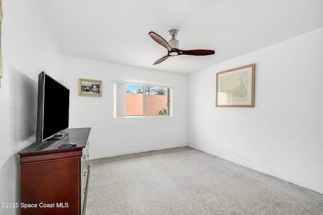 1700 Atlantic St Unit 1, Melbourne Beach, FL 32951 - unfurnished bedroom with a ceiling fan, baseboards, and carpet floors