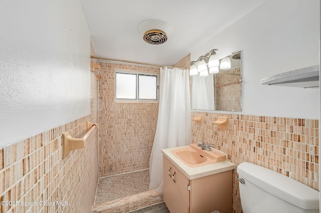 1700 Atlantic St Unit 1, Melbourne Beach, FL 32951 - full bath featuring tile walls, tiled shower, vanity, and toilet