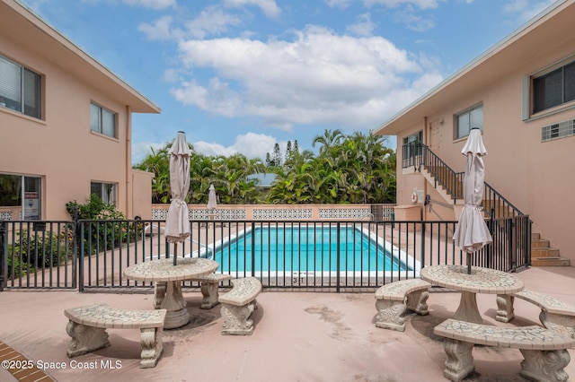 1700 Atlantic St Unit 1, Melbourne Beach, FL 32951 - community pool featuring stairway and a patio