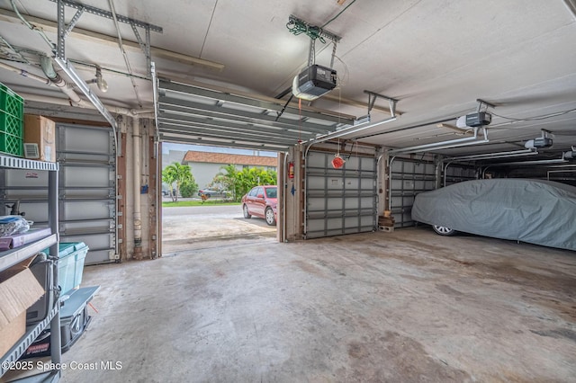 1700 Atlantic St Unit 1, Melbourne Beach, FL 32951 - garage featuring a garage door opener