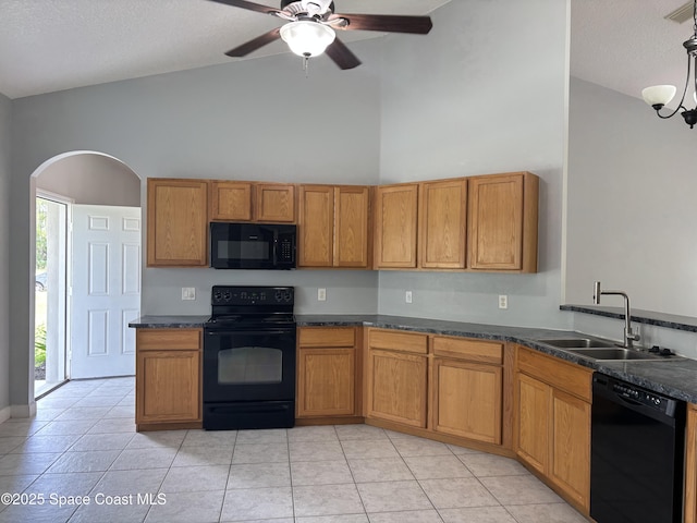 3197 Weyburn Ave SE, Palm Bay, FL 32909 - kitchen with black appliances, a sink, brown cabinetry, high vaulted ceiling, and a ceiling fan