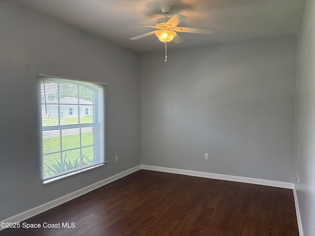3197 Weyburn Ave SE, Palm Bay, FL 32909 - empty room featuring dark wood-style flooring, ceiling fan, and baseboards