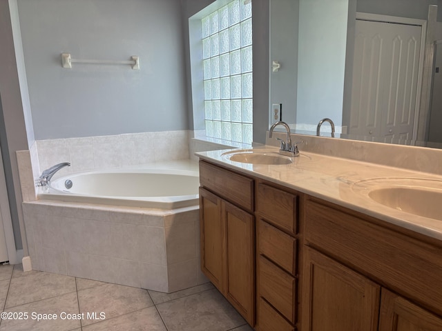 3197 Weyburn Ave SE, Palm Bay, FL 32909 - bathroom with a bath, double vanity, and tile patterned flooring