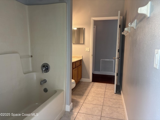 3197 Weyburn Ave SE, Palm Bay, FL 32909 - bathroom featuring vanity, tile patterned floors, shower / washtub combination, toilet, and baseboards