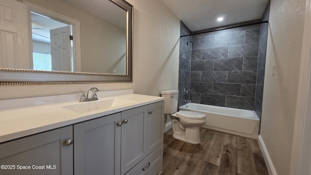 1880 Murrell Rd Unit E19, Rockledge, FL 32955 - full bathroom with wood finished floors, vanity, toilet, baseboards, and shower / washtub combination