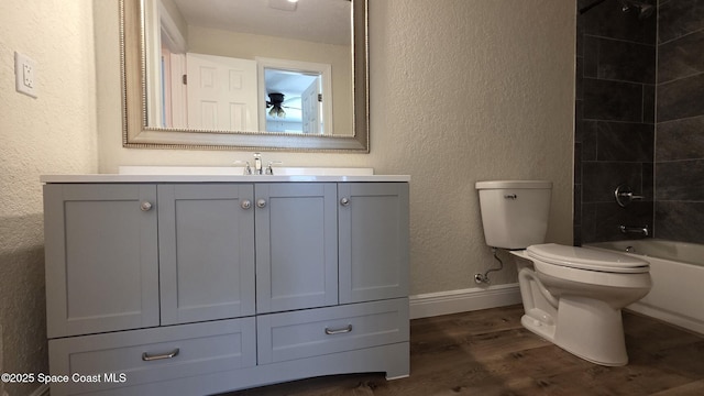 1880 Murrell Rd Unit E19, Rockledge, FL 32955 - full bathroom featuring wood finished floors, baseboards, vanity, toilet, and a textured wall