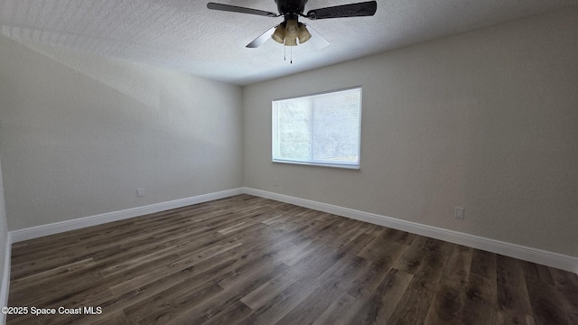 1880 Murrell Rd Unit E19, Rockledge, FL 32955 - spare room featuring dark wood-type flooring, a textured ceiling, ceiling fan, and baseboards