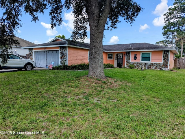 598 Consolata Ave NW, Palm Bay, FL 32907 - ranch-style home with stone siding and an attached garage