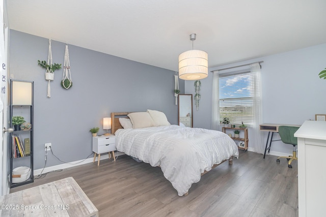 2039 Snapdragon Dr NW, Palm Bay, FL 32907 - bedroom featuring wood finished floors and baseboards