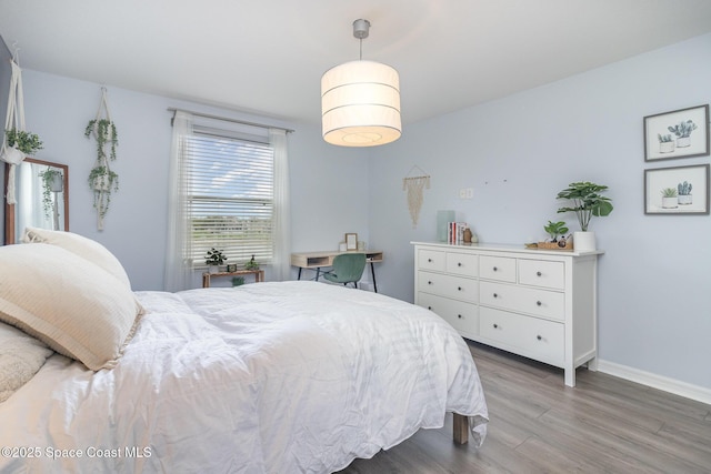 2039 Snapdragon Dr NW, Palm Bay, FL 32907 - bedroom with wood finished floors and baseboards