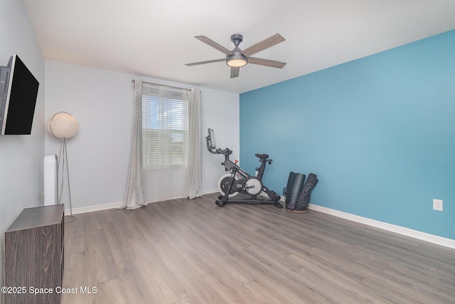 2039 Snapdragon Dr NW, Palm Bay, FL 32907 - workout room with a ceiling fan, wood finished floors, and baseboards